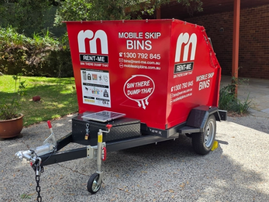 Mobile Skip Bin operator delivering a trailer-mounted skip bin
